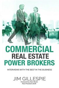 Cover of the book titled 'Commercial Real Estate Power Brokers: Interviews with the Best in the Business' by Jim Gillespie. The cover shows two businessmen walking with a green-tinted cityscape in the background. The author's name appears at the bottom along with a forward by Stan Mullin.