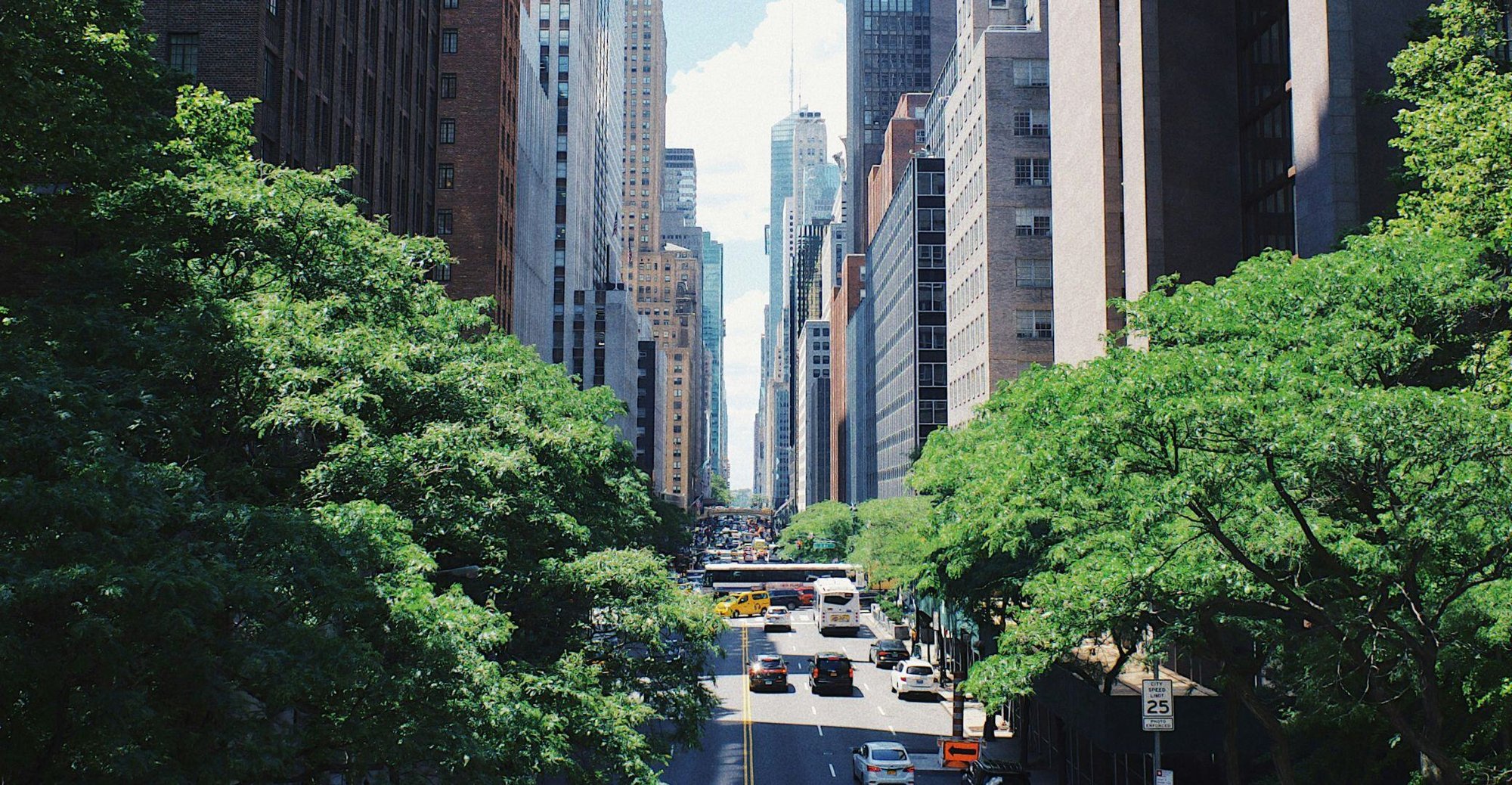 yellow-car-running-on-the-street-between-the-building-during-daytime commercial hard money loans-2